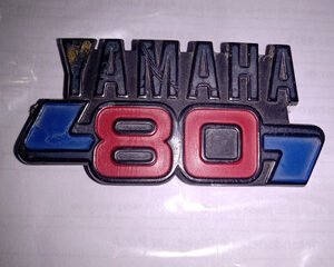 EMBLEMA BABERO V80 (FACTORY)